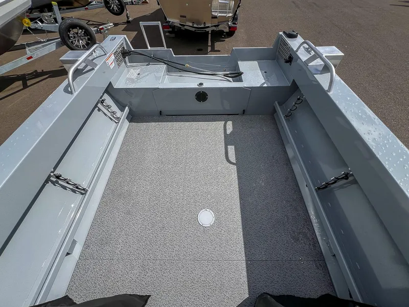 Slide: The Image of 2024 Hewescraft 200 Sportsman boat interior, showing spacious deck and storage compartments. - 14