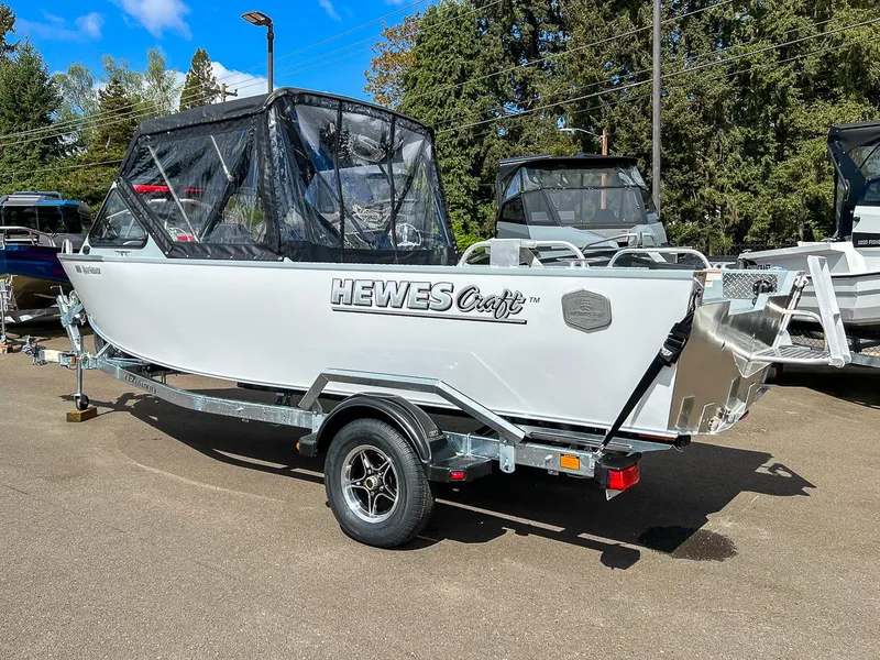 Slide: The Image of 2024 Hewescraft 200 Sportsman boat on a trailer, outdoor display. - 3
