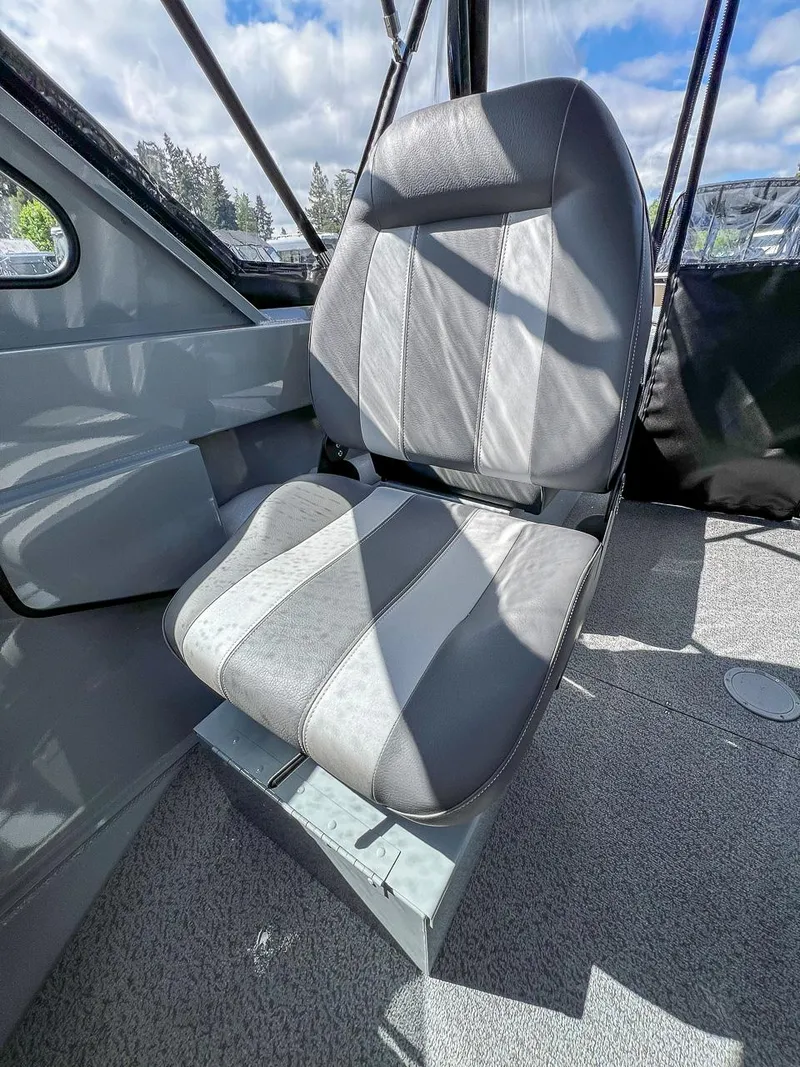 Slide: The Image of 2024 Hewescraft 200 Sportsman boat interior seat with gray upholstery. - 11