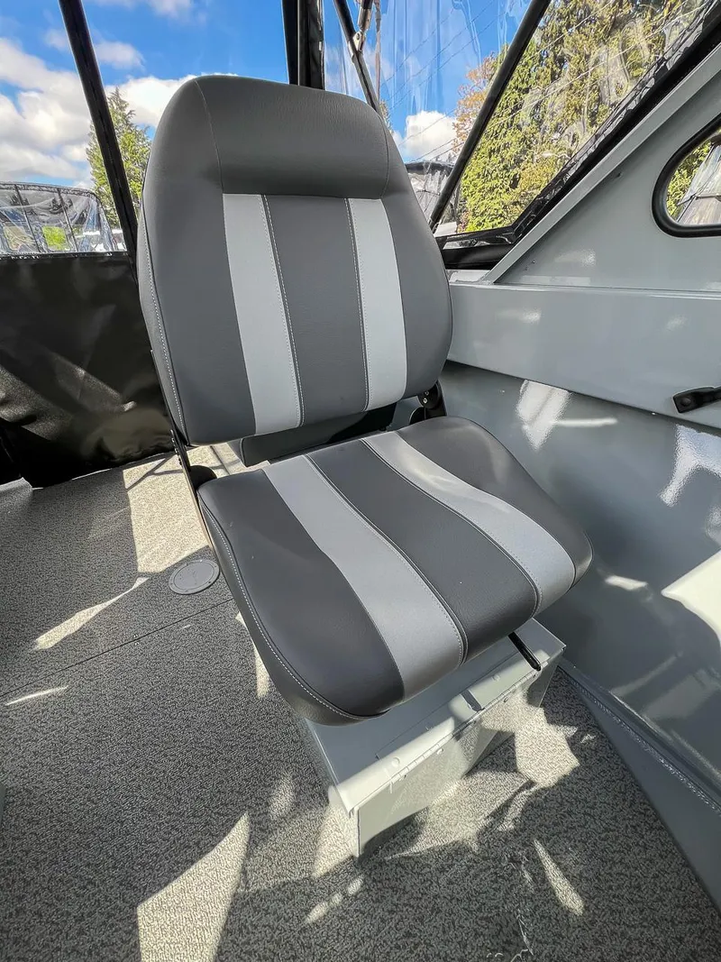 Slide: The Image of 2024 Hewescraft 200 Sportsman boat interior seat with gray and black upholstery. - 12