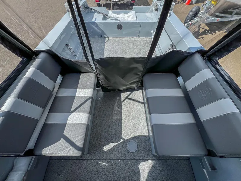 Slide: The Image of Interior of 2024 Hewescraft 200 Sportsman boat with gray and black seating. - 13