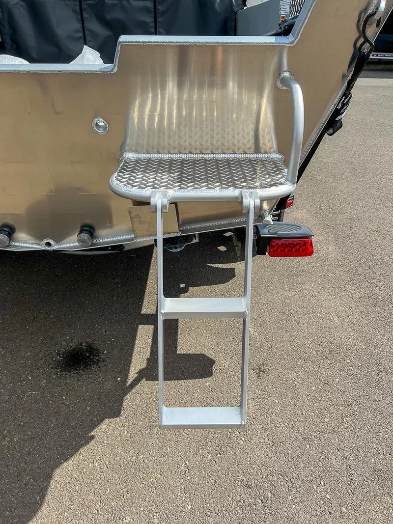 Slide: The Image of 2024 Hewescraft 200 Sportsman boat with a foldable metal ladder. - 16