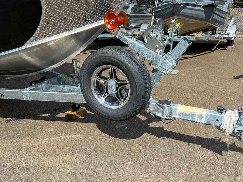 Slide: The Image of 2024 Hewescraft 200 Sportsman boat trailer with spare tire and winch. - 17