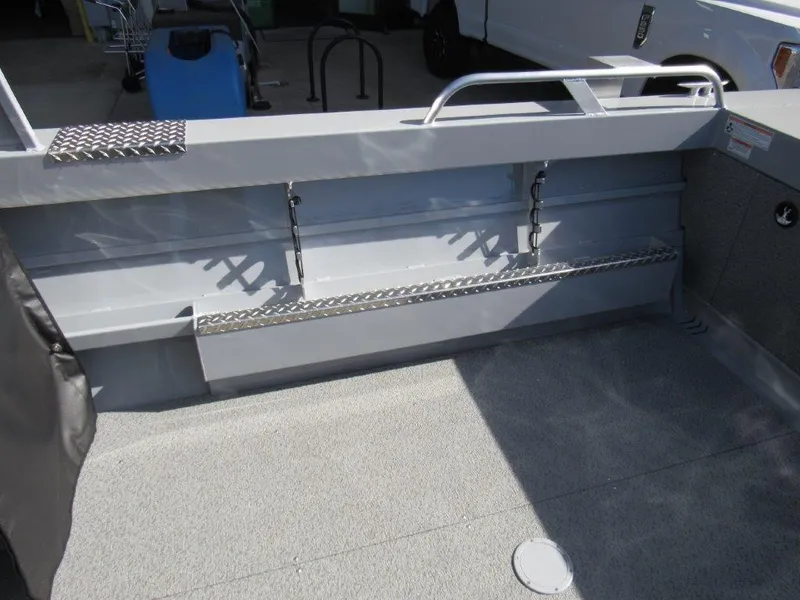 Slide: The Image of Interior view of 2024 Hewescraft 200 PRO V ET HT boat showing storage and seating area. - 10