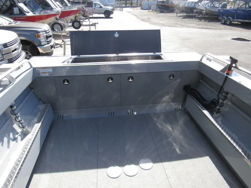 Slide: The Image of 2024 Hewescraft 200 PRO V ET HT boat interior, spacious deck with storage compartments. - 11
