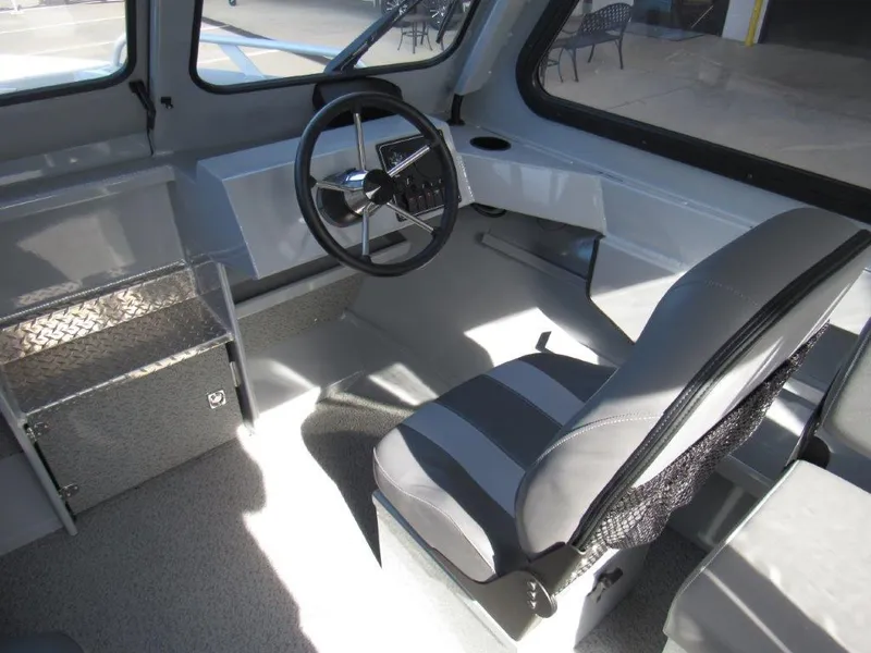 Slide: The Image of Interior of 2024 Hewescraft 200 PRO V ET HT boat with steering wheel and seating. - 12