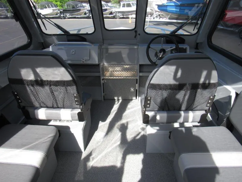 Slide: The Image of Interior of 2024 Hewescraft 200 PRO V ET HT boat with seating and steering wheel. - 17
