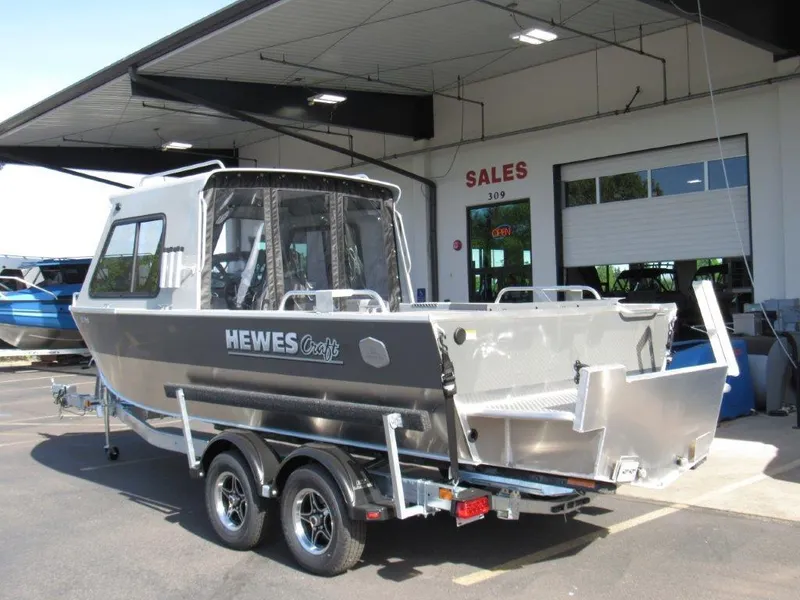 Slide: The Image of 2024 Hewescraft 200 PRO V ET HT boat on trailer outside sales building. - 3