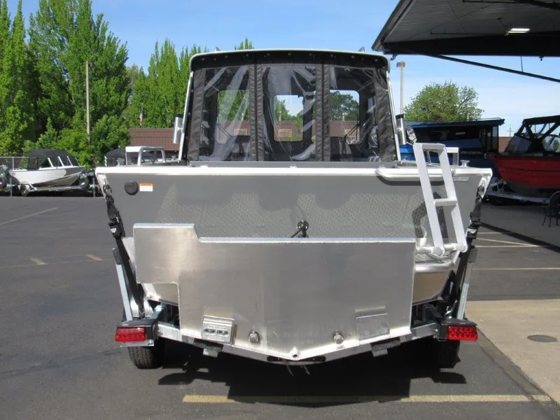 Slide: The Image of 2024 Hewescraft 200 PRO V ET HT boat rear view in a parking lot. - 4