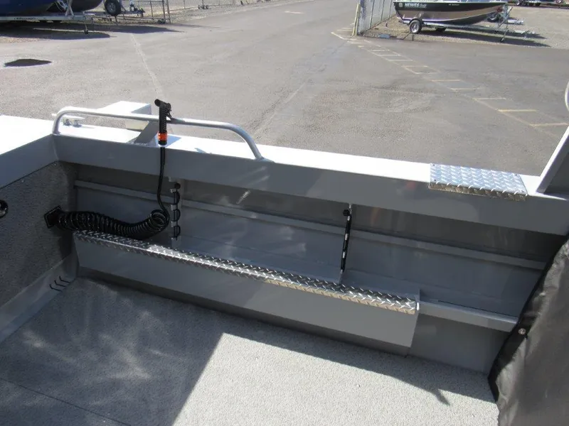 Slide: The Image of 2024 Hewescraft 200 PRO V ET HT boat interior, showing storage and coiled cable. - 9