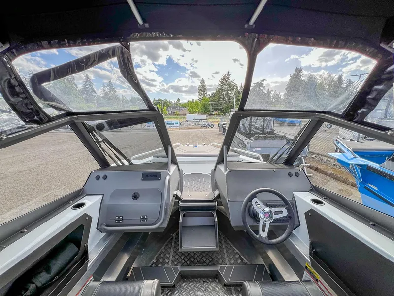 Slide: The Image of 2024 Stabicraft 2050 Treker Sportfish boat interior with steering wheel and dashboard. - 6