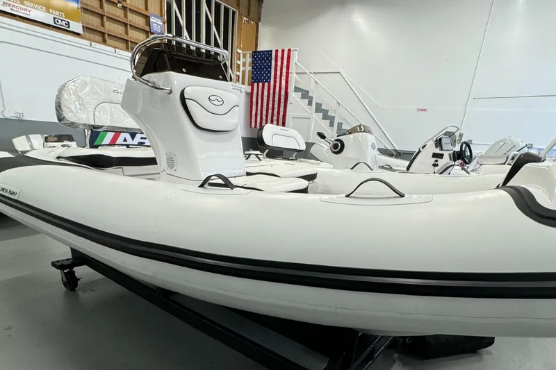 The Image of 2024 Walker Bay Gen 13 LTE inflatable boat in showroom, featuring sleek design and modern features. - 0