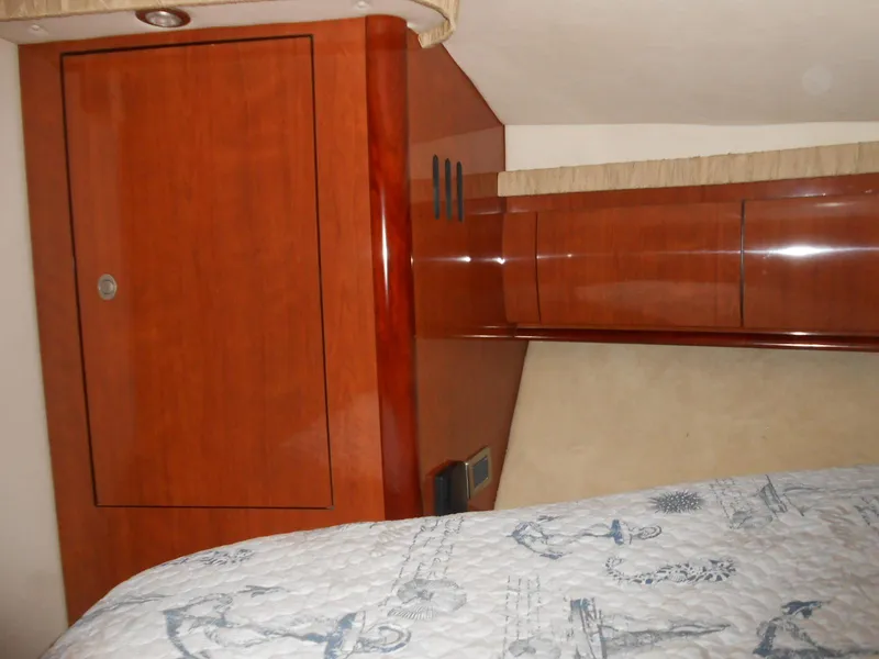 Slide: The Image of Interior cabin of a 2004 Sea Ray 420 Sundancer yacht with wooden cabinetry. - 25
