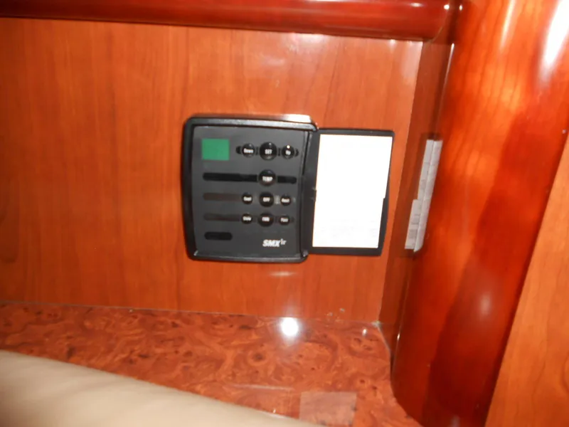Slide: The Image of Control panel inside 2004 Sea Ray 420 Sundancer yacht with wooden interior. - 31