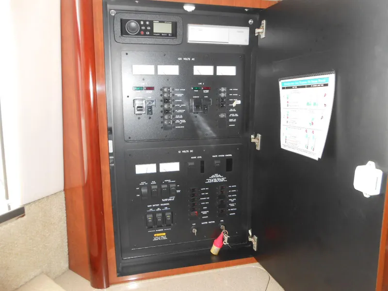 Slide: The Image of Electrical control panel inside a 2004 Sea Ray 420 Sundancer yacht. - 32