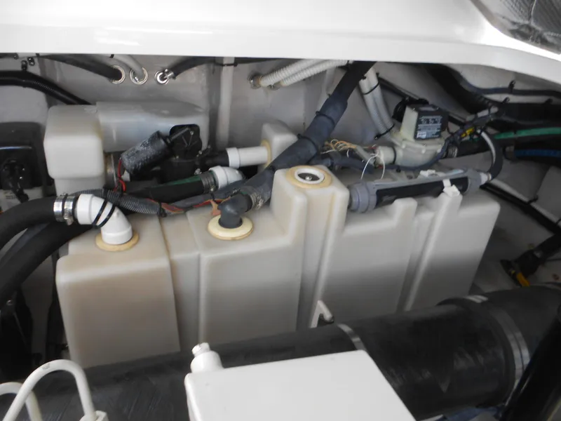 Slide: The Image of Engine compartment of a 2004 Sea Ray 420 Sundancer boat showing fuel tanks and wiring. - 41