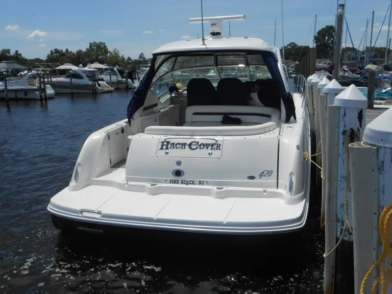 Slide: The Image of 2004 Sea Ray 420 Sundancer docked at marina, rear view. - 6