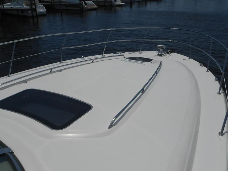 Slide: The Image of 2004 Sea Ray 420 Sundancer yacht bow deck with railing. - 7