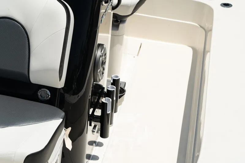Slide: The Image of Close-up of ShearWater X22 boat interior, 2025 model, featuring seating and rod holders. - 13