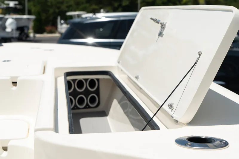 Slide: The Image of Open storage compartment on a 2025 ShearWater X22 boat. - 14