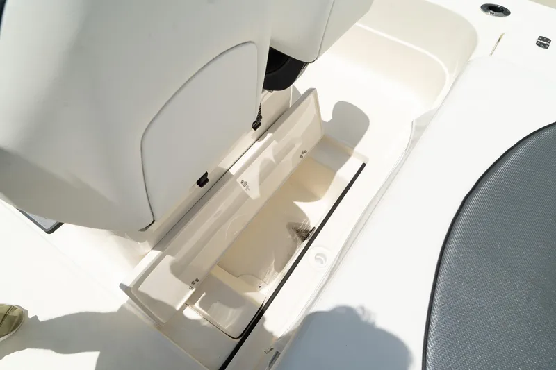 Slide: The Image of ShearWater X22 2025 boat storage compartment under seat. - 18