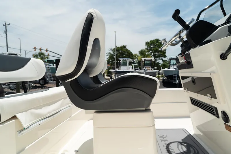 Slide: The Image of ShearWater X22 2025 boat interior with modern seating and control console. - 7