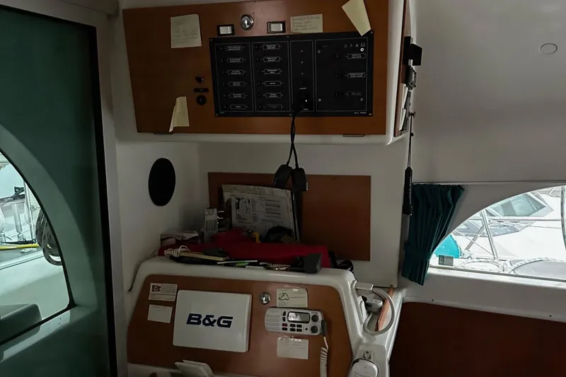 Slide: The Image of Interior of a 2001 Lagoon 380 catamaran with navigation equipment and control panel. - 10