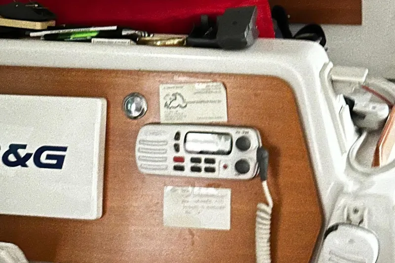 Slide: The Image of Control panel of a 2001 Lagoon 380 catamaran with communication equipment. - 11