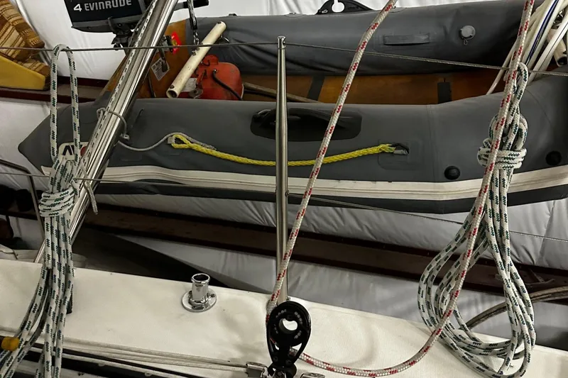 Slide: The Image of Ropes and equipment on a 2001 Lagoon 380 catamaran with inflatable boat. - 21
