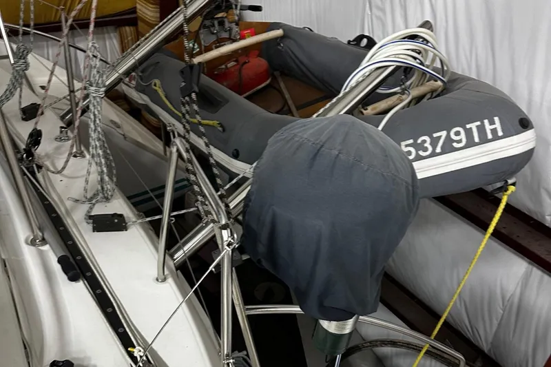 Slide: The Image of Lagoon 380 catamaran, 2001 model, with inflatable dinghy and covered outboard motor. - 30