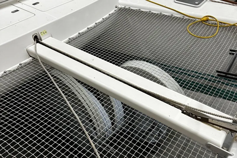 Slide: The Image of Netting and ropes on a 2001 Lagoon 380 catamaran deck. - 5