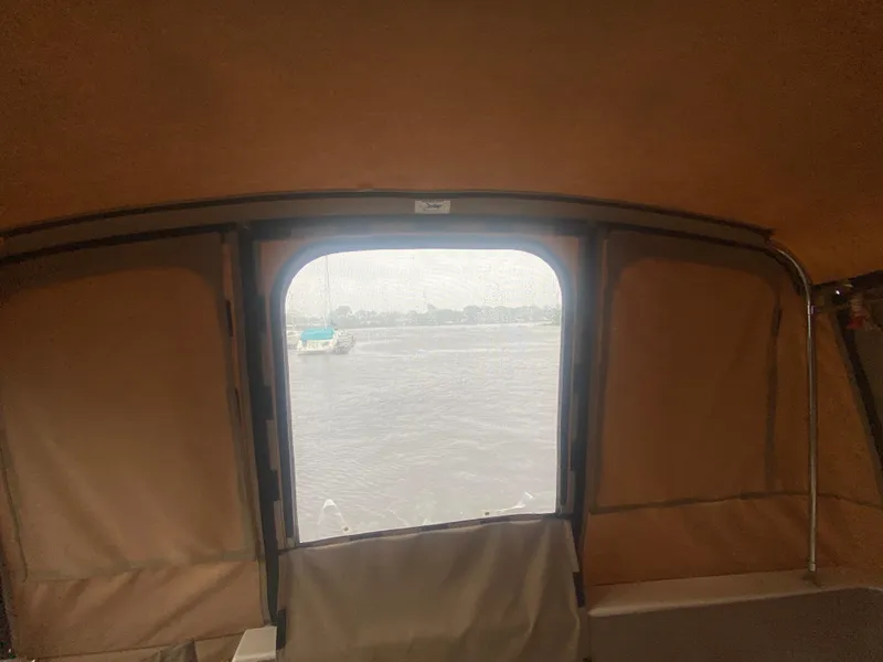 Slide: The Image of View from inside a 1993 Cruisers 3675 boat, looking out at the water. - 12
