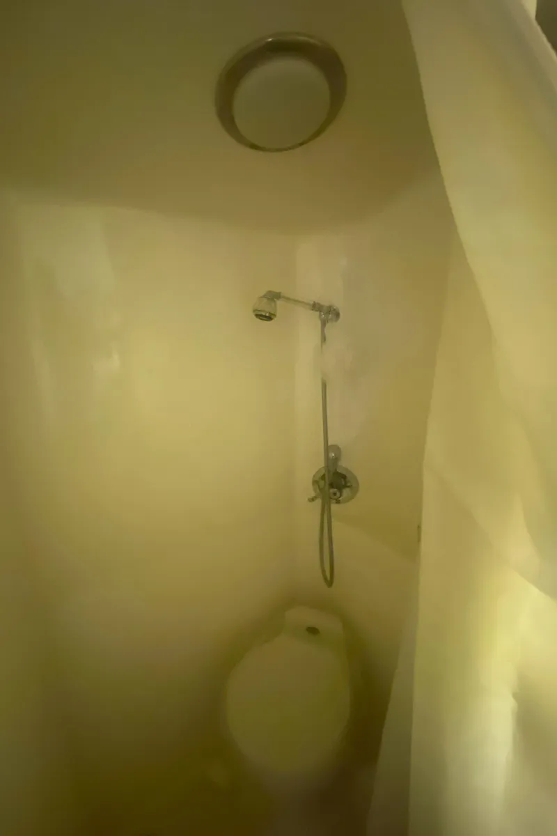 Slide: The Image of Compact bathroom with shower in 1993 Cruisers 3675 boat. - 16