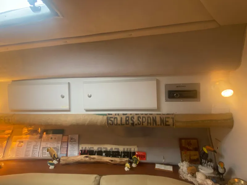 Slide: The Image of Interior of a 1993 Cruisers 3675 boat with storage cabinets and decor. - 22