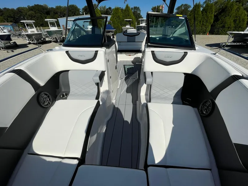 Slide: The Image of 2024 Chaparral 270 OSX boat interior with sleek seating and modern design. - 15