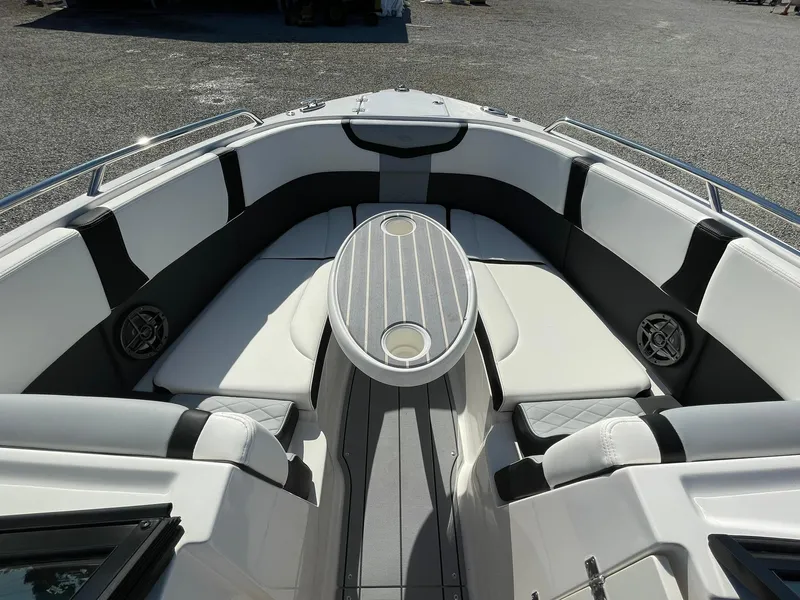 Slide: The Image of 2024 Chaparral 270 OSX boat interior with sleek seating and modern design. - 23