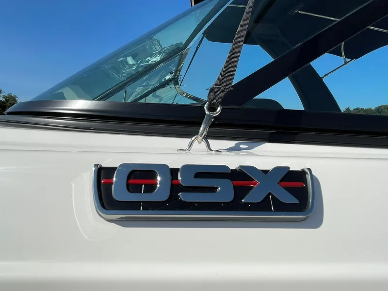 Slide: The Image of 2024 Chaparral 270 OSX boat emblem close-up with sleek design. - 3