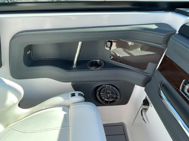 Slide: The Image of 2024 Chaparral 270 OSX interior detail with speaker and cup holder. - 45