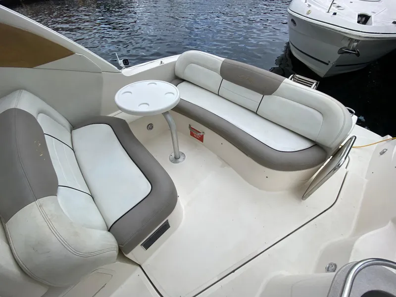 Slide: The Image of 2008 Sea Ray 310 Sundancer boat interior with seating and table. - 10