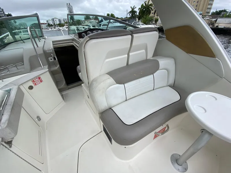 Slide: The Image of 2008 Sea Ray 310 Sundancer boat interior with seating and table. - 12