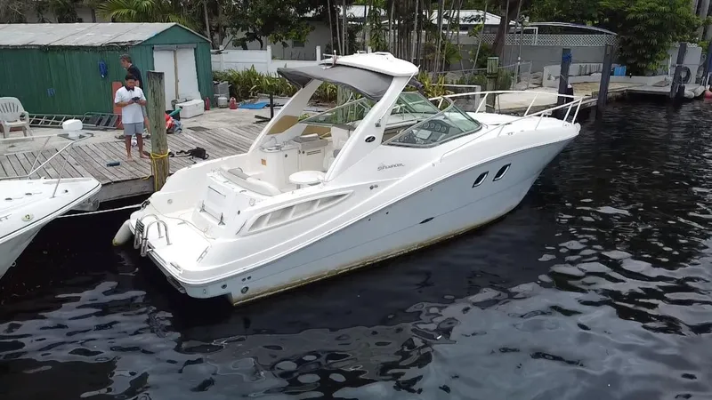 Slide: The Image of 2008 Sea Ray 310 Sundancer docked at a marina. - 21