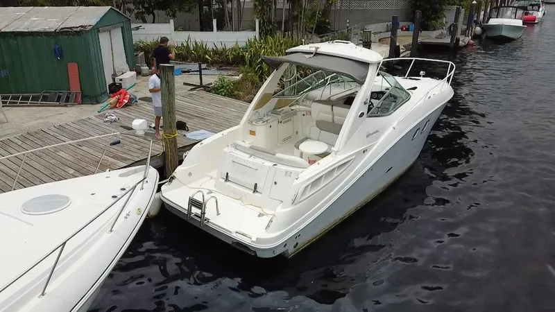 Slide: The Image of 2008 Sea Ray 310 Sundancer docked at a marina. - 22