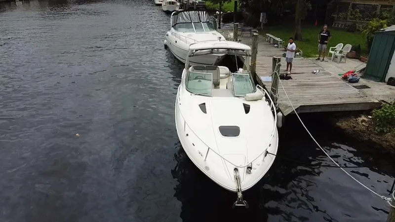 Slide: The Image of 2008 Sea Ray 310 Sundancer docked at a marina. - 3