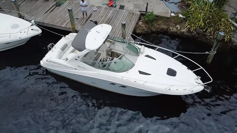 Slide: The Image of 2008 Sea Ray 310 Sundancer docked at a marina, aerial view. - 4