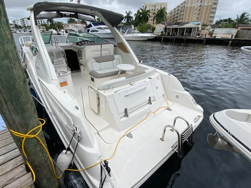 Slide: The Image of 2008 Sea Ray 310 Sundancer docked at marina, rear view. - 9