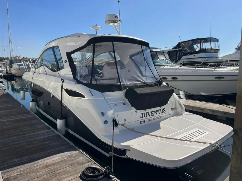 Slide: The Image of 2018 Sea Ray Sundancer 350 docked, featuring sleek design and modern amenities. - 14