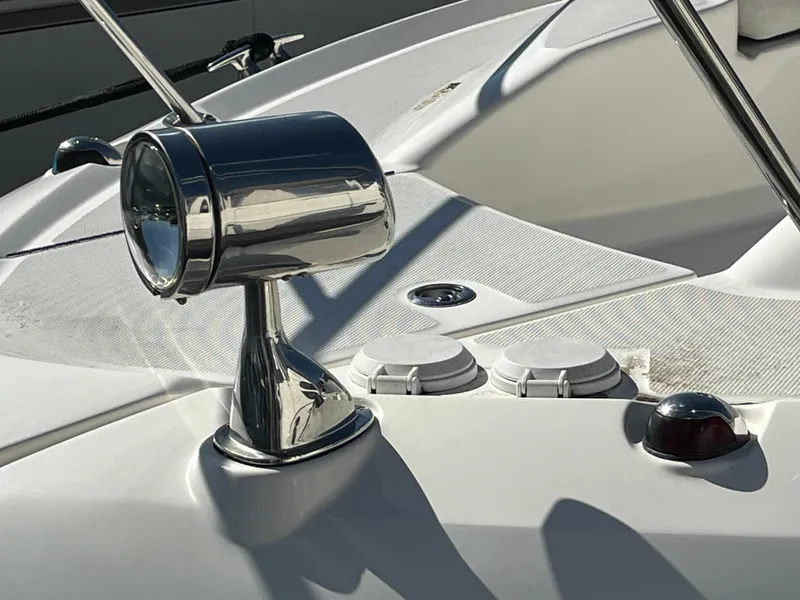 Slide: The Image of 2018 Sea Ray Sundancer 350 boat deck with chrome spotlight and fittings. - 16