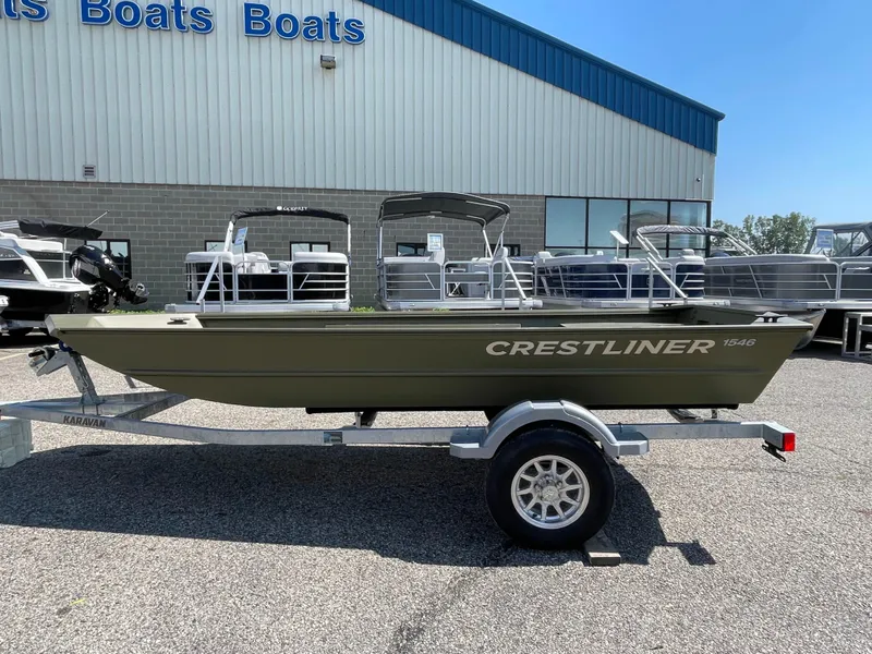 The Image of 2024 Crestliner 1546 Retriever boat on trailer outside dealership. - 0