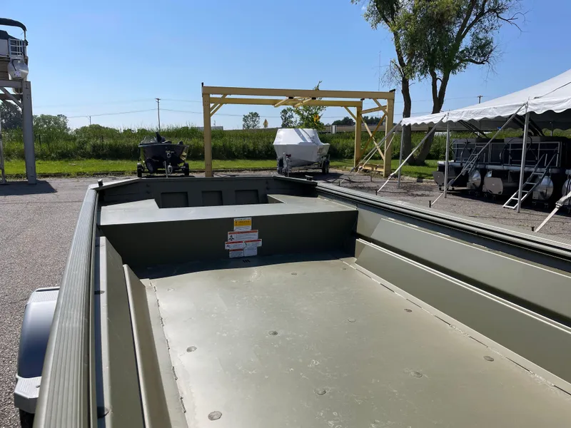 Slide: The Image of 2024 Crestliner 1546 Retriever boat, empty interior view, parked outdoors. - 3