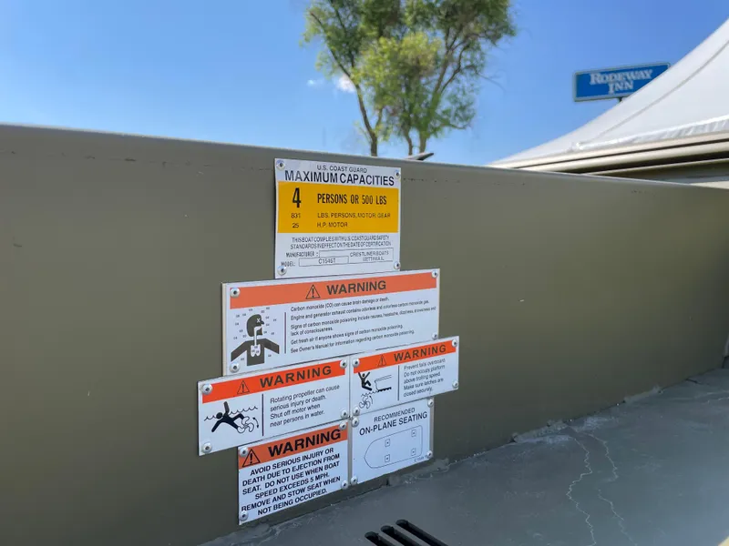 Slide: The Image of Warning labels on a 2024 Crestliner 1546 Retriever boat. - 4